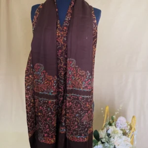 Handwoven burgundy brown cashmere scarf, displayed on a mannequin.