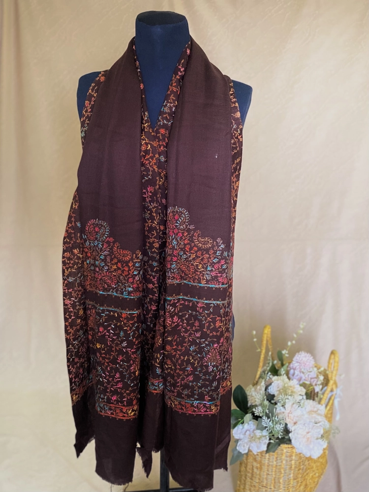 Handwoven burgundy brown cashmere scarf, displayed on a mannequin.