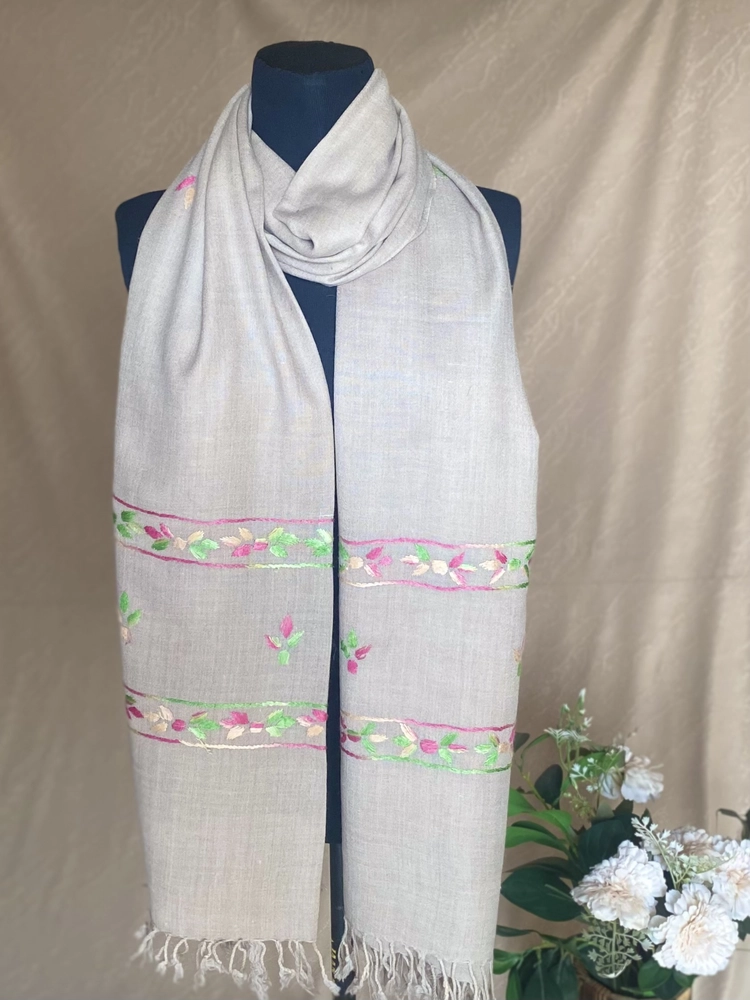 Handwoven light grey pink floral cashmere shawl, displayed on a mannequin.