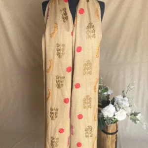 Handwoven light brown cashmere shawl with intricate multicolored embroidery, displayed on a mannequin.