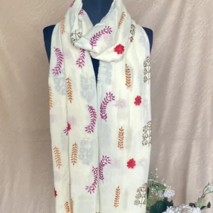 Handwoven off-white cashmere shawl with intricate multicolored embroidery, displayed on a mannequin.