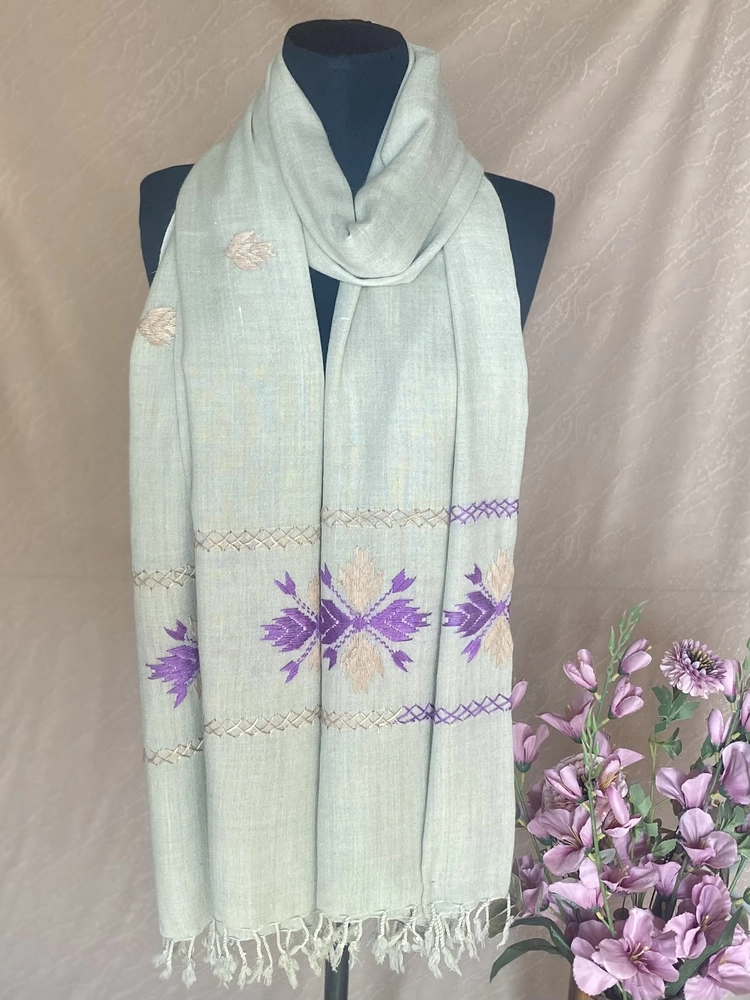 Handwoven pink and purple embroidered cashmere shawl, displayed on a mannequin.